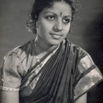 Young Subbulakshmi with thick curls and a puff sleeve blouse